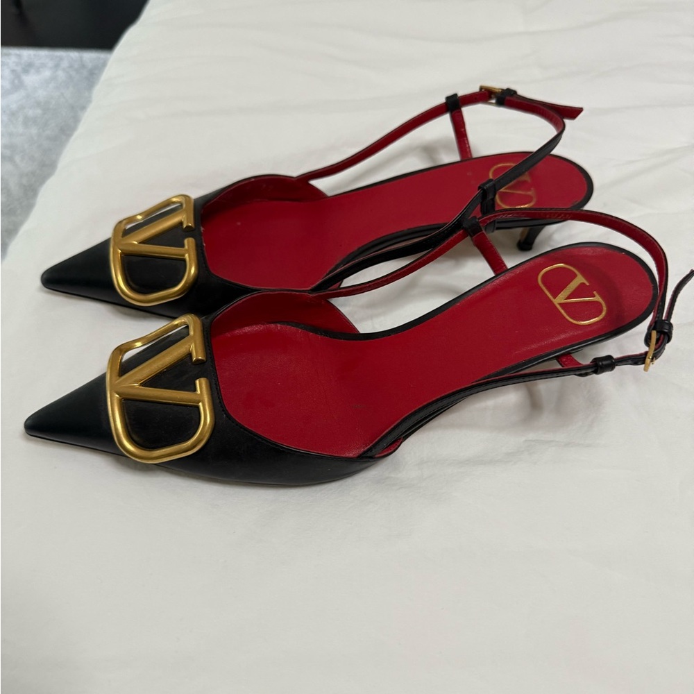 Valentino Garavani Black Leather Slingback Pumps with Gold Logo and Red Insole